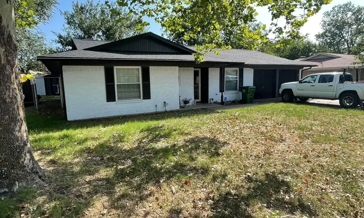 Professional roofing crew working on a residential roof in Oradell